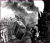 Soviet soldiers raise their flag over the Reichstag in Berlin in 1945.