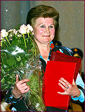 alentina Tereshkova holds flowers and gifts after a ceremony to mark the 40th anniversary of her space flight, at the Russian Cosmonaut Training Center in Star City near Moscow, Monday, June 16, 2003. 